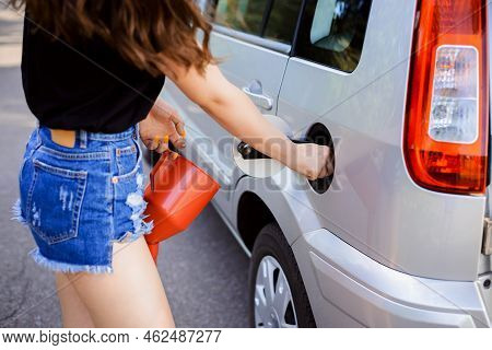 Girl Driver Opens Car Fuel Tunk Before Filling It Using Jerrican