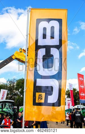 Samara, Russia - September 24, 2022: Dealership Flag Jcb At The Annual Volga Agro-industrial Exhibit