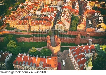 Old City In Warsaw With Red Roofs, Poland From Above. Travel Outdoor European Background With Wall A