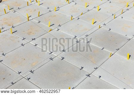 Detail Of Veranda Tiles With Yellow Distance Keeper.  The Yellow Plastic Spacers Have The Function O