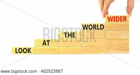 Look At The World Wider Symbol. Concept Words Look At The World Wider On Wooden Blocks On A Beautifu