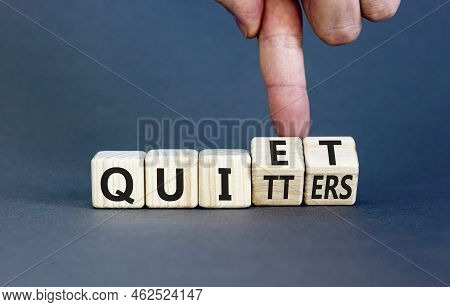 Quiet Quitters Symbol. Concept Words Quiet Quitters On Wooden Cubes. Businessman Hand. Beautiful Gre