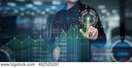 Business Man Working With Financial Growth Graph On Virtual Computer Screen.