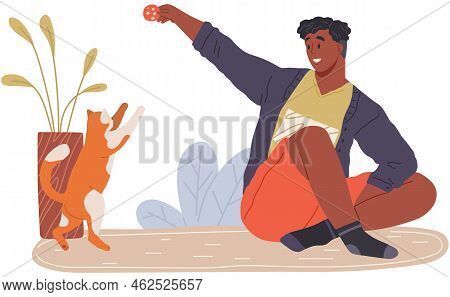 Male Pet Owner With Cat Training, Playing With Ball. Caring For Four-footed Friend Concept. Happy Gu