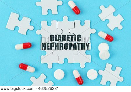 Medical Concept. On A Blue Background, Pills, Capsules And Puzzles With The Inscription - Diabetic N