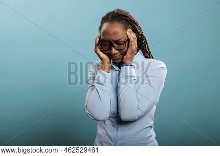 Overworked And Stressed Young Adult Person Putting Pressure On Temples With Fingers Because Of Painf