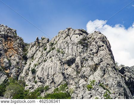 Paklenica, Croatia, Eu - June 25, 2022: Distant View Of Mountain Climbers In National Park Paklenica
