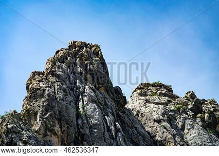 Paklenica, Croatia, Eu - June 25, 2022: Distant View Of Mountain Climbers In National Park Paklenica