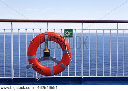 Vaasa, Finland - June 20, 2022: The Railing Of A Boat With An Orange Lifebuoy