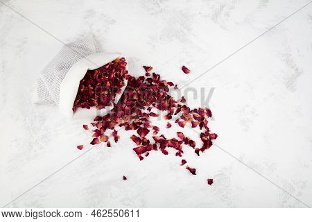 Dried Rose Petals In Pouch, Top View. Light Background, Copy Space. Pink Colored Organic Herb Used F