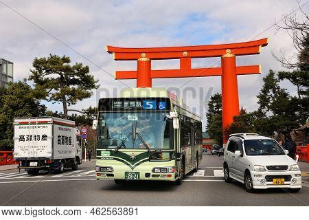 Kyoto, Japan - November 24, 2016: City Bus Drives Under The Largest Torii Gate In Japan. Kyoto Has 1