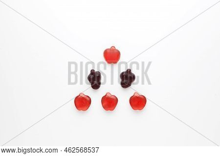 Chewy Fruit Marmalade With Natural Juice And Pectin Is Laid Out In Triangle Shape On A Light Backgro