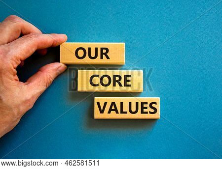 Our Core Values Symbol. Concept Words Our Core Values On Wooden Blocks On A Beautiful Blue Table Blu
