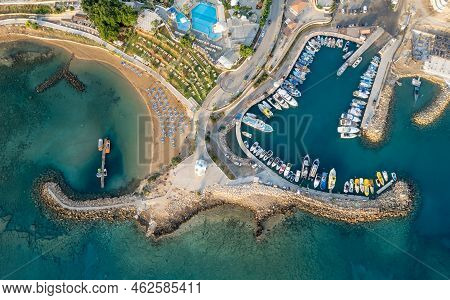 Drone Aerial Scenery Of A Fishing Port At Pernera Protaras Cyprus. Fishing Boats Moored In The Harbo