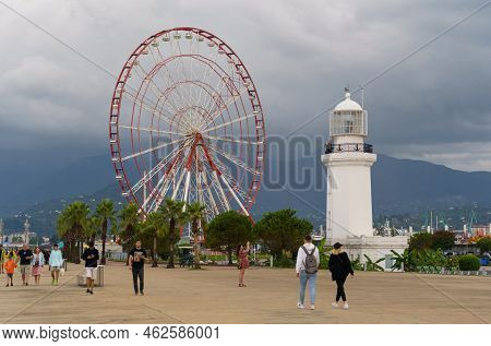Batumi, Georgia, Ajaria - September 06, 2022: View Of The Lighthouse And Ferris Wheel On The Embankm