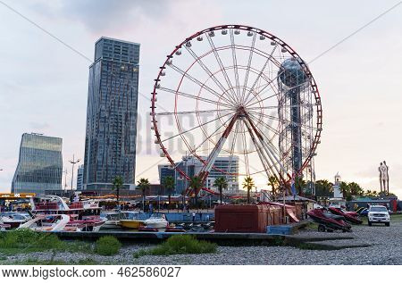 Batumi, Georgia, Ajaria - September 06, 2022: View Of The Lighthouse And Ferris Wheel On The Embankm