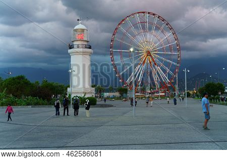 Batumi, Georgia, Ajaria - September 06, 2022: View Of The Lighthouse And Ferris Wheel On The Embankm