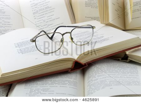 Many Books And Glasses On It