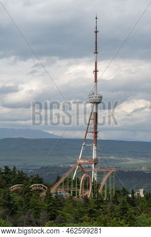 Tv Tower With Antenna Wires Used For Supporting Television Transmitting And Broadcasting. Tall Metal
