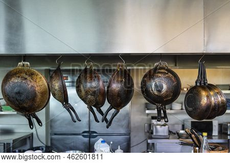 Many Frying Pans Hanging In The Kitchen, Close Up