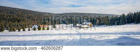 Historical Tourist Village On Sunny Winter Day With Cross-country Skiers Around. Orle, Jizera Mounta