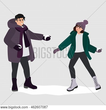 Man And Woman At Snowball Fight On Winter Holidays. People Having Fun And Throwing Snow Balls, Playi