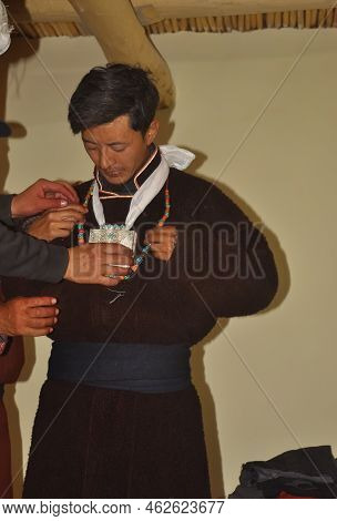 Friends Helping To Getting Ready A Ladakhi Groom From Zanskar Valley Inside Room In The Night