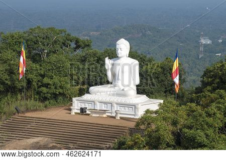 Mihintale, Sri Lanka - February 05, 2020: Sitting Buddha Sculpture On A Sunny Morning. Ambastala Pla