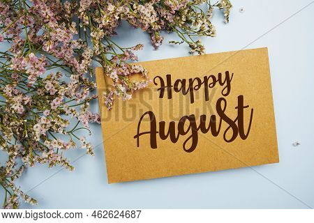 Happy August Written On Paper Card With Flower Frame Decoraton On Pink Background