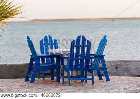Pation With Blue Furniture On The Beach.