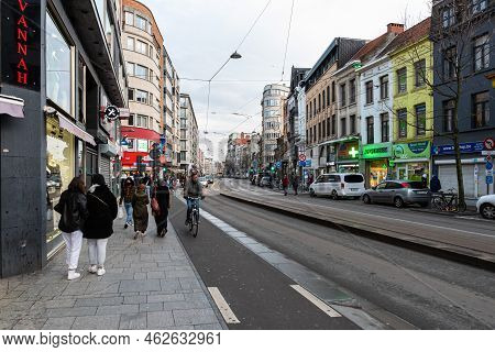 Antwerp, Flanders - Belgium - 12 28 2020 - Multi Cultural People Walking Along The Bussy Road And Tr
