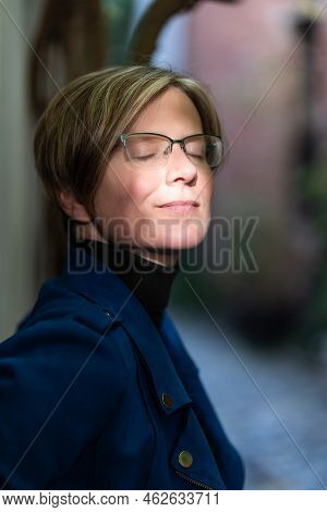 Portrait Of An Attractive Thirty Year Old White Woman Posing In A Narrow Street, Brussels