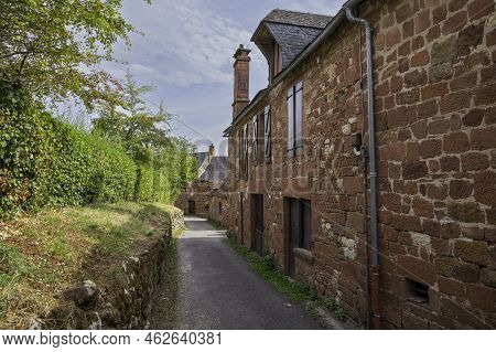Collonges La Rouge, Distinctive Red Brick Houses And Towers Of The Medieval Old Town, France. It Is 