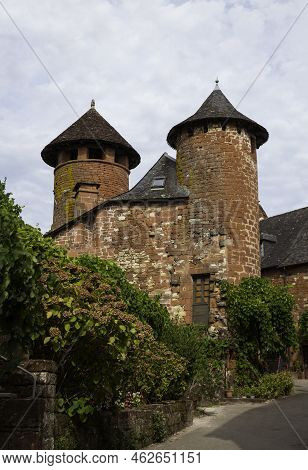 Collonges La Rouge, Distinctive Red Brick Houses And Towers Of The Medieval Old Town, France. It Is 