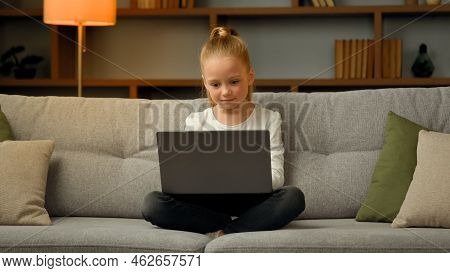 Cute Little Gamer Schoolgirl Child Playing Online Modern Computer Games Completing Gaming Level Chat