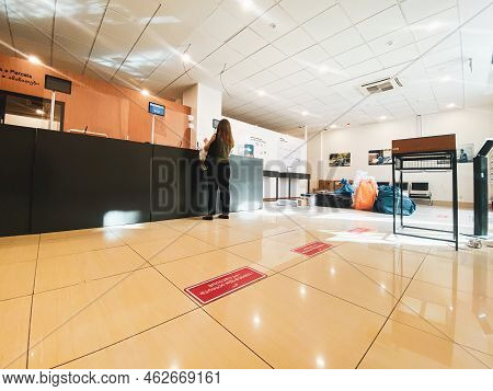 Tbilisi, Georgia - 25 October, 2022: Customer Stand Alone In Post Office By Desk Talk With Postal Se