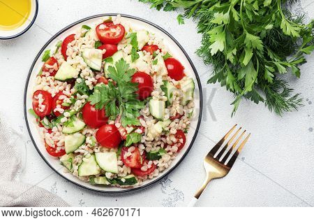 Bulgur Tabbouleh Salad With Fresh Tomatoes, Cucumbers And Parsley. Traditional Middle Eastern And Ar