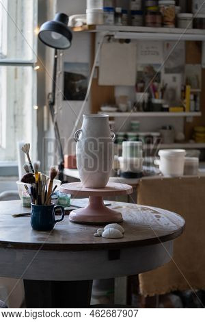 Clay Vase Dries Up Standing On Wooden Rack. Masterpiece Prepared For Making Sketch And Painting Stan