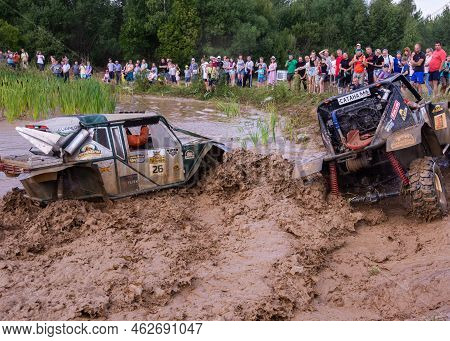 Russia - August 12, 2023, Tver. The Car Overcomes Difficult Obstacles. Large-scale Sports Competitio