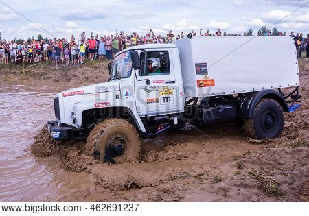 Russia - August 12, 2023, Tver. The Car Overcomes Difficult Obstacles. Large-scale Sports Competitio
