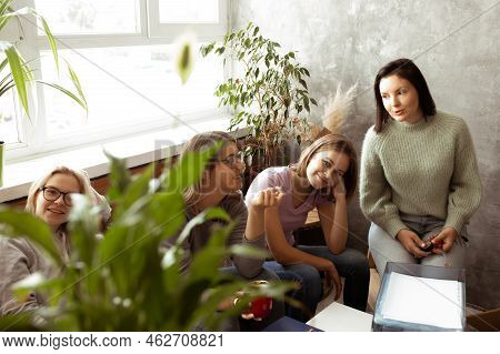 Positive, Smiling Tired Women Sit Together, Packing Luggage In Living Room. Relocation, Waiting For 
