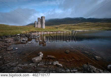 A Old Castle On The Shore Mountain Lake. Ardvreck Castle On The Shore Of Loch Assynt, North West Hig