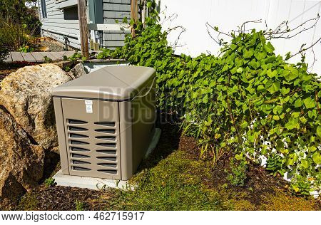 Residential Standby Generator On A Concrete Pad
