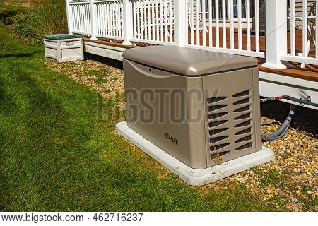 Newbury, Usa - September 29, 2022: Residential Standby Generator On Concrete Pad