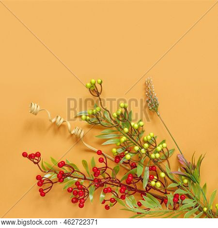 Autumn Oak And Rowan Branches With Red Berries On Orange Background.
Flat Lay, Top View, Copy Space 
