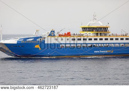 Thassos, Greece - August 25, 2022: Ferryboat Taking People And Their Cars From Continental Greece To