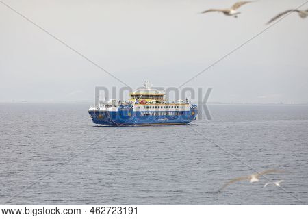 Thassos, Greece - August 25, 2022: Ferryboat Taking People And Their Cars From Continental Greece To