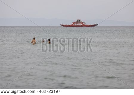 Thassos, Greece - August 25, 2022: Ferryboat Taking People And Their Cars From Continental Greece To