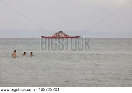 Thassos, Greece - August 25, 2022: Ferryboat Taking People And Their Cars From Continental Greece To