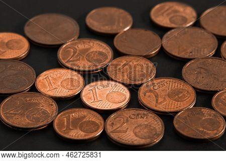 Small Change Coins Close-up. Caper Euro Cent Coins On A Black Background.